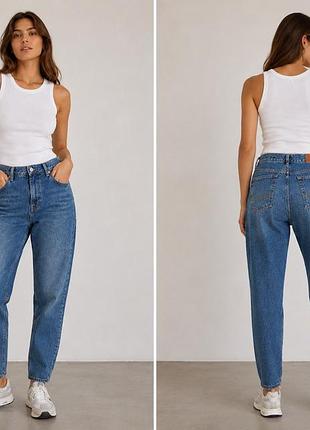 На зображенні представлені жіночі джинси levi's column jeans у класичному синьому кольорі зі злегка вінтажним ефектом