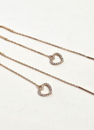 Серьги протяжки золотые с подвесками и белым круглым фианитом.