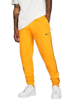 Штани nocta drake x nike nocta au essential fleece pant yellow da3935-739