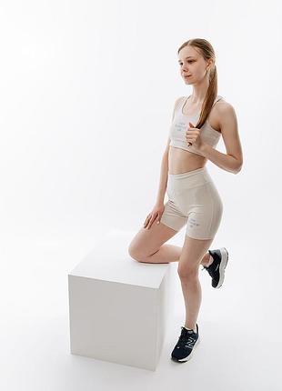 Жіночий топ нью баланс оригінал new balance essentials reimagined bra wb31500mbm