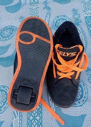Роликові кросівки чорно-жовтогарячі heelys propel устілка 22 см з одним колесом унісекс оригінал модель
