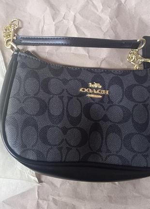 Сумка багет coach чорна, комплектація: сумка, 2 ремені (короткий та довгий), фірмовий пильник coach 
сумка чорна з золотими елементами