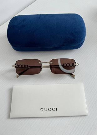 Сонцезахисні окуляри gucci прямокутна форма з лого на срібній оправі