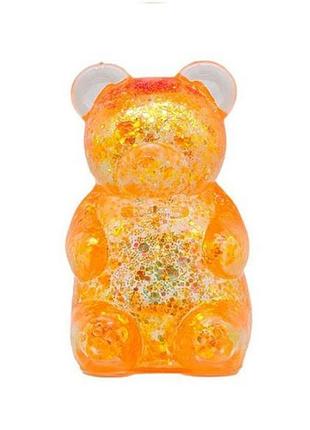Антистресс мишка с глиттером squishy gummy bear glitter 7×4 см оранжевый 1 шт