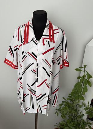 Блузка с разрезами в абстрактный принт 52 р от exclusive collection