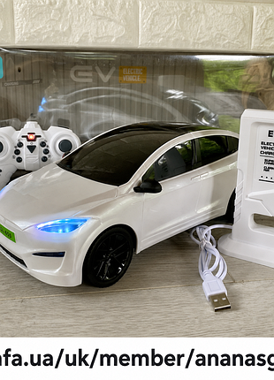 Машинка на радіокеруванні tesla model x біла 30.5 см із зарядною станцією (горять фари, звук, парківка)