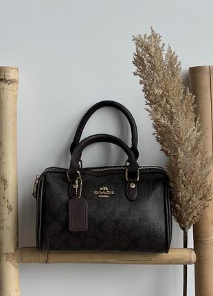 Coach mini rowan crossbody in signature шоколадний