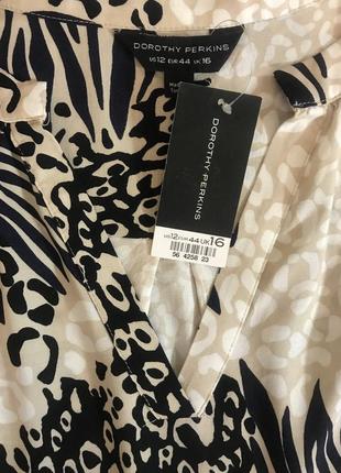 Нереально красивая и стильная брендовая блузка..100% вискоза.1 фото