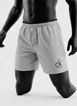 Брендові оригінальні спортивні світло сірі легкі шорти calvin klein , розмір xl