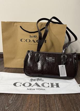 Сумка coach коричневого кольору