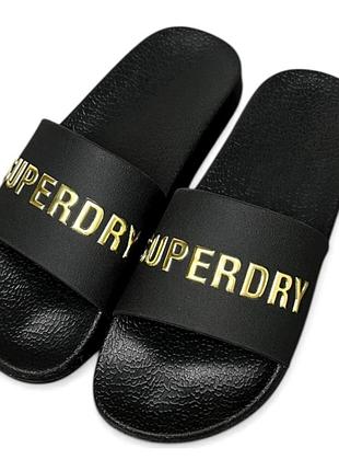 Нові шльопанці  superdry з золотистим логотипом.
