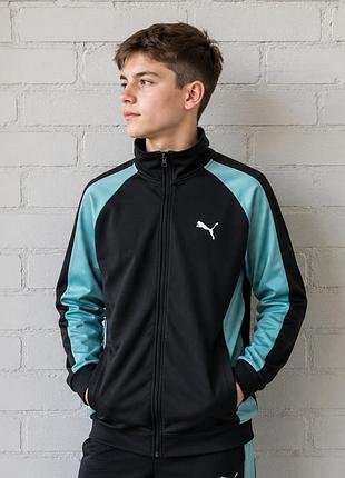 Спортивна кофта puma чорного кольору з бірюзовими вставками на рукавах має вишитий білий логотип бренду на грудях.чорна олімпійка puma  на 13-14 років