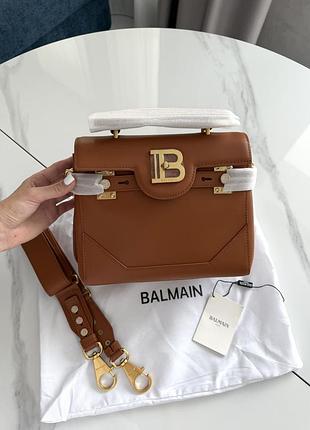 Balmain brown gold logo