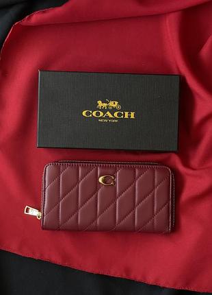 Женский кошелек coach quilted leather zip around long walle бордовый большой коуч