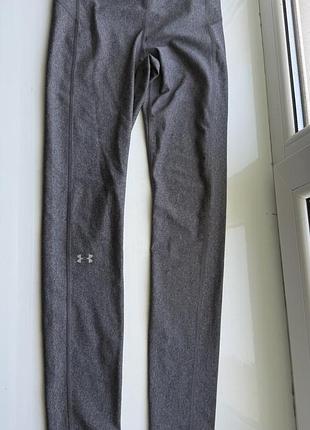 Легінси лосіни від under armour мають сірий меланжевий колір та еластичний пояс із фірмовим логотипом розмір с-м