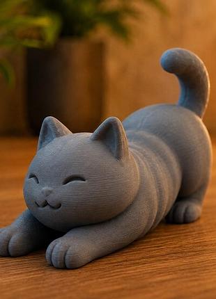 Статуетка котика, що потягується