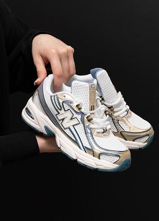 Стильные женские кроссовки new balance 740 blue/gold