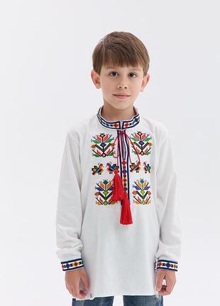 Вишиванка для хлопчика подільська тканина біла, орнамент різнокольоровий