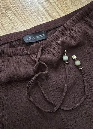 Zara брюки жатка коричневі поточна колекція 2026