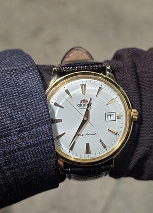 Годинник orient bambino version 1 fac00003w0 золото, автомат f6724