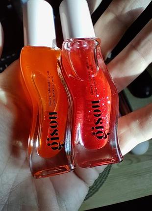 Масло для губ gisou honey infused lip oil.