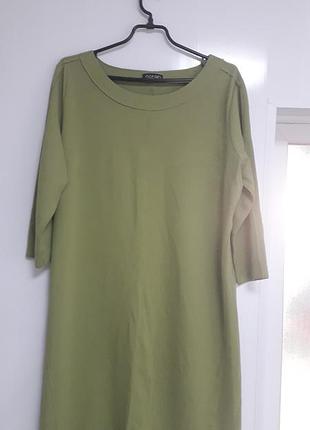 Noran
44/xxl/52
стильна жіноча сукня оливково зеленого кольору,  круглий виріз , рукав 3/4, декоративні шви
60%бавовна нейлон спандекс 
ідеальний стан
