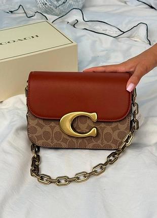 Жіноча сумка coach idol shoulder bag in signature canvas коричнева