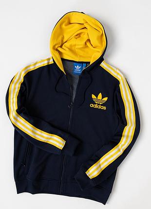 Чоловіча худі-кофта adidas originals темно-синього кольору з жовтою підкладкою капюшона та культовими трьома смужками на рукавах. модель має повнор