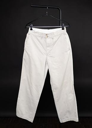 Чоловічі штани levis regulation chinos бежевого кольору, виконані зі 100% бавовни. класична модель із прямими штанинами, застібкою на ґудзики, боковим