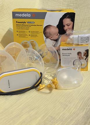 Електронний двофазний молоковідсмоктувач medela freestyle hands-free.