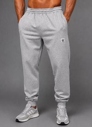 Чоловічі спортивні штани adidas originals світло-сірий меланж двонитка бавовна демісезонні на манжетах,осінь-весна