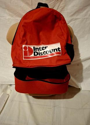 Красный рюкзак с логотипом «inter discount» и отдельным нижним отделением