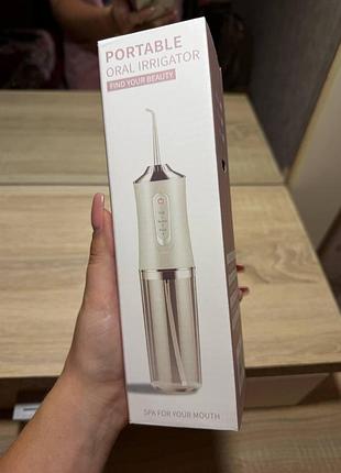 Портативный ирригатор для ротовой полости (portable oral irrigator)