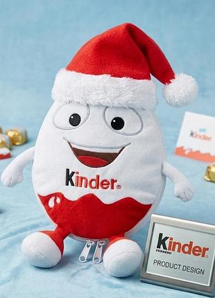Плюшева сумочка-пенал kinderino (kinder) у шапці санти — оригінальний мерч ferrero. артикул / код товару: 29chs22.
виробник: kinder (ferrero)