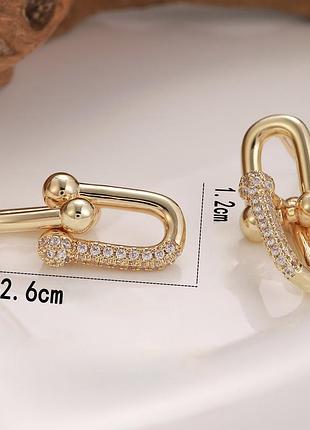 Серьги-гвоздики в стиле "tiffany" с белыми кристаллами позолота 18к.