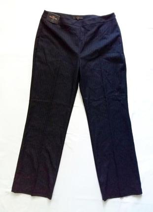 Новые темно-синие брюки next в серую полоску.1 фото