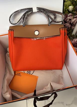 Оранжевая сумка кожа и текстиль лого бренд herbag zip 31 cm