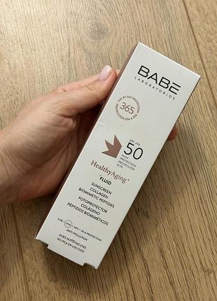 Антивіковий сонцезахисний флюїд для обличчя з колагеном та пептидами babe laboratorios healthy aging fluid spf 50 об'ємом 40 мл