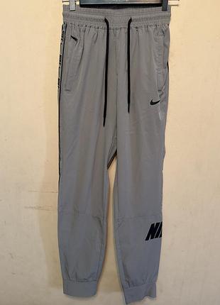 Брюки спортивные унисекс nike  storm-fit стрейч винтаж