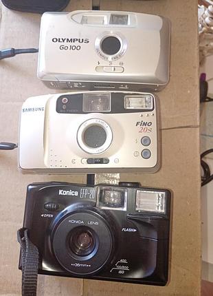 Пленочная камера фотоаппарат olimpus go100, konica.135 мм. пленка. в рабочем состоянии.