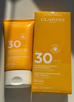 Сонцезахисний крем для тіла clarins youth-protecting sunscreen spf 30 повний формат 150мл
