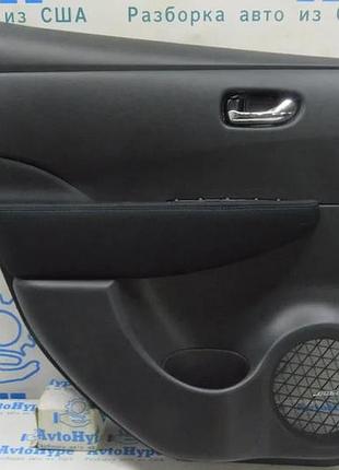 Обшивка двери карточка задн лев nissan leaf 18-21 черн с вставк кожа,подлокотн тряпка bose