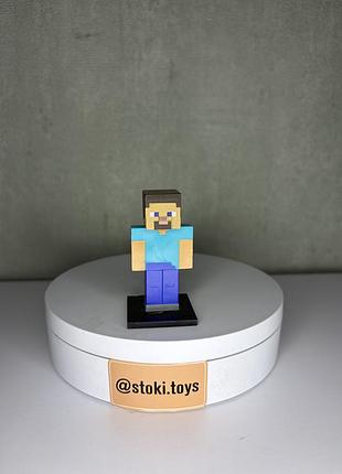 Колекційна фігурка стів minecraft steve на підставці (pmi mojang)