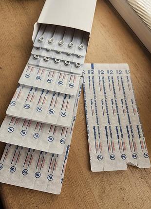 Комплект традиционных стерильных гок на штанге (needle on bar), которые используются для роторных и индукционных тату-машинок.