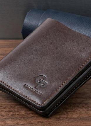 Вертикальное глянцевое портмоне с накладной монетницей grande pelle 11330 шоколадное