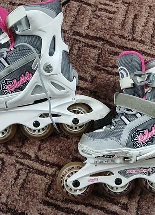 Детские раздвижные роликовые коньки на 4 позиции бренда rollerblade (модельного ряда spitfire) с композитной рамой и подшипниками sg3. размер 33-36.