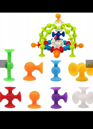 Яркий детский силиконовый конструктор на присосках (squigz или стикезы), состоящий из разноцветных фигурок различной формы