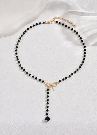 Цепочка женская с черными бусинками и бантиком fashion jewelry золотистая