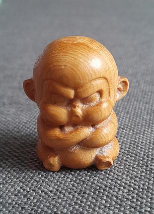 Древесная фигурка сердечника