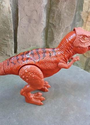 Детская игрушка динозавра rex.